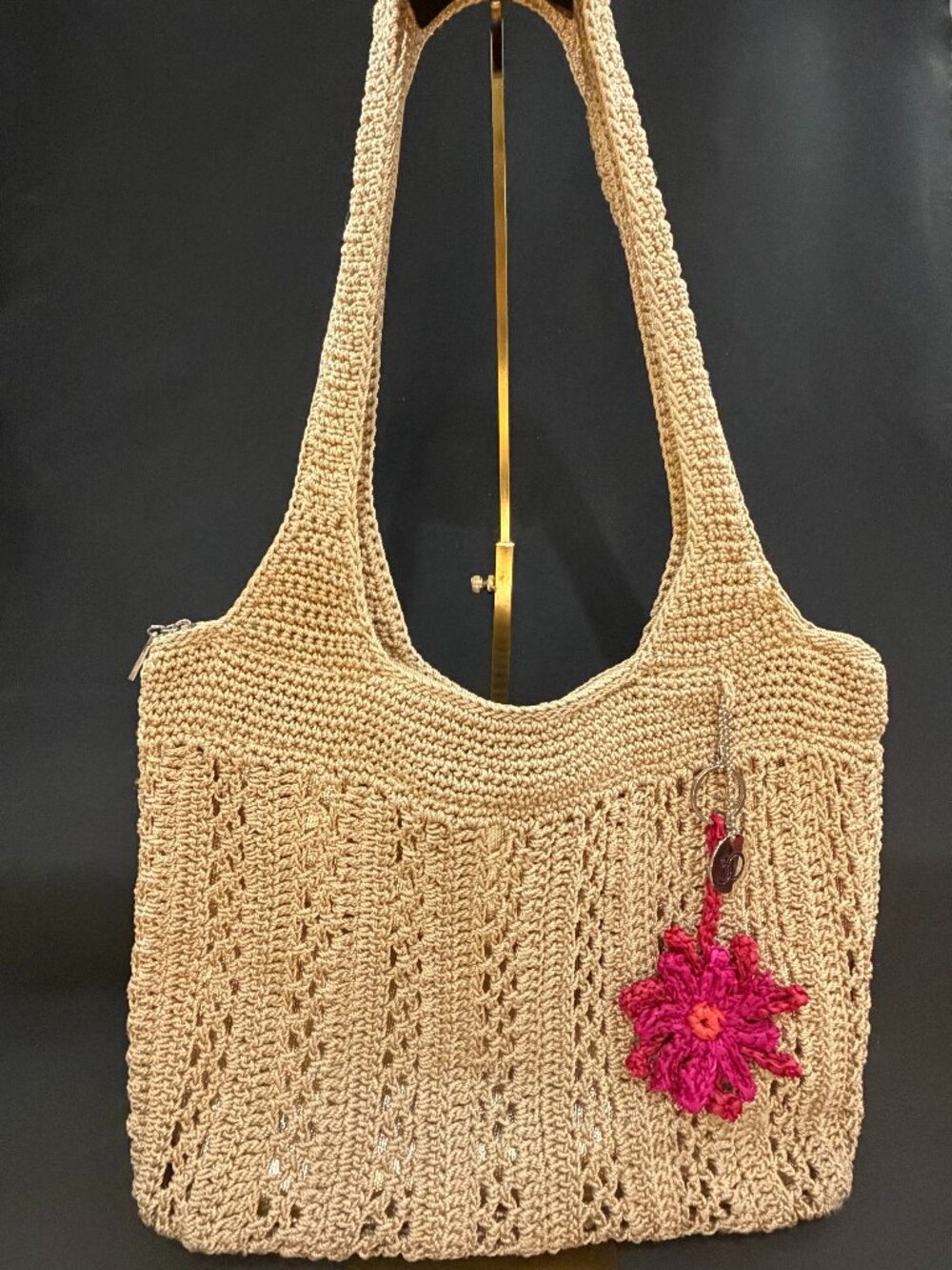 The Sak Crochet Tote in Bamboo Color with Gold Lining & Charms.